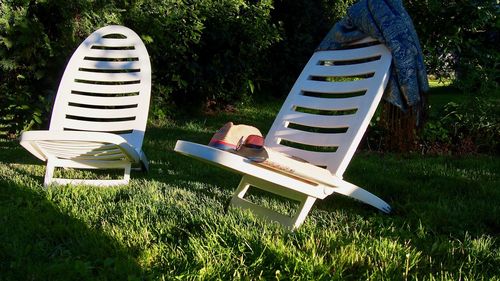 View of empty chairs in yard