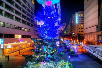 Illuminated city street at night