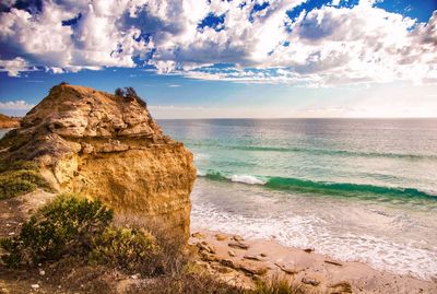 Scenic view of sea against cloudy sky