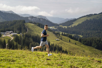 Full length of man on field against mountains
