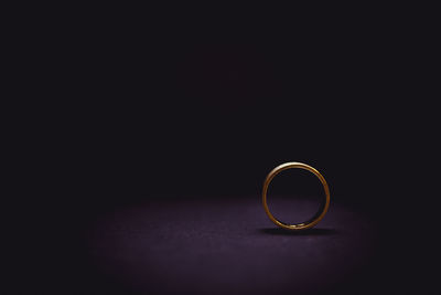 Close-up of wedding rings on black background