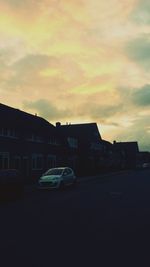 View of buildings against sky at sunset