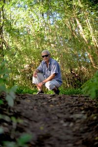 Young woman with umbrella in farm