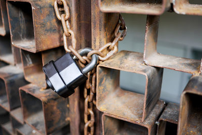 Close-up of padlocks on metal chain