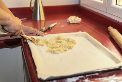 Cropped image of person preparing food