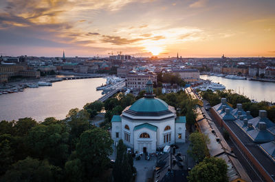 High angle view of buildings against sky at sunset