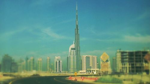 Skyscrapers against cloudy sky