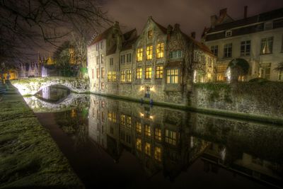 Reflection of illuminated buildings in canal at night