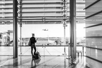 Full length rear view of man at airport