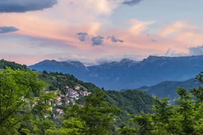 Scenic view of mountains against sky at sunset