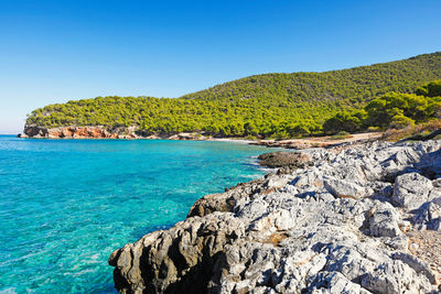 Scenic view of sea against clear blue sky