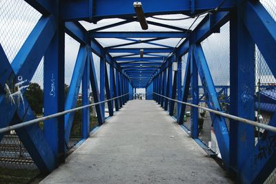 View of metallic bridge against sky