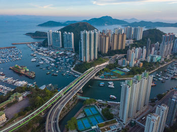 Aerial view of cityscape against sky during sunset