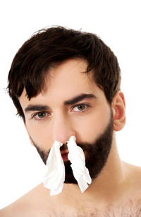 Portrait of young man against white background