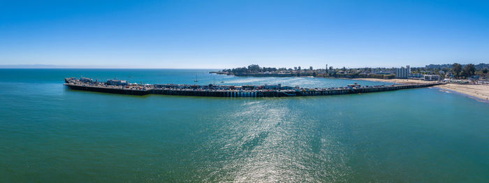 High angle view of sea against clear blue sky