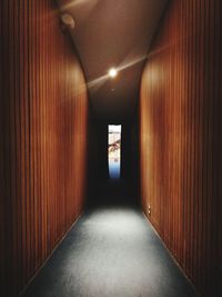 Empty corridor in illuminated tunnel