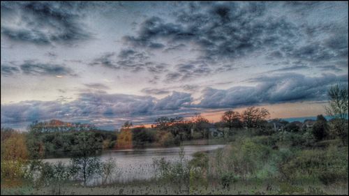 Scenic view of landscape against cloudy sky