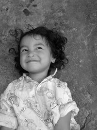 Portrait of cute girl smiling and looking away from the camera