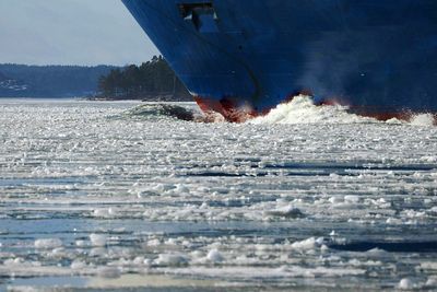 Frozen sea against sky