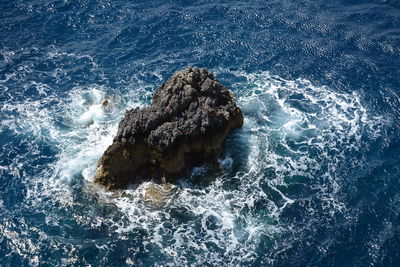 Close-up of rock in sea