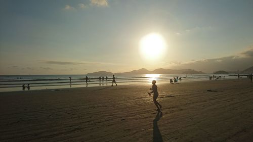 Scenic view of beach against sky during sunset