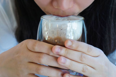 Close-up of woman holding ice cream