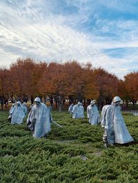 Panoramic view of korean war veteran memorial against trees on field against sky