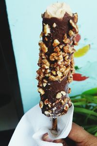 Cropped hand holding ice cream