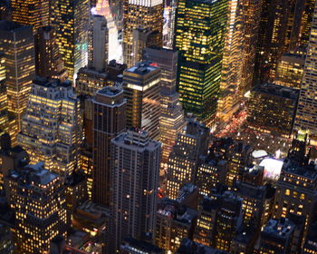 High angle view of illuminated buildings in city