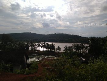 Scenic view of landscape and mountains against sky