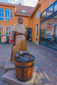 Statue in front of building