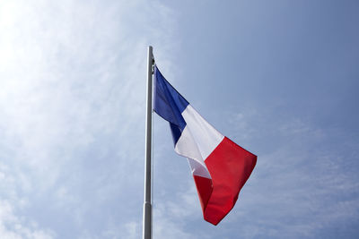 Low angle view of flag against sky