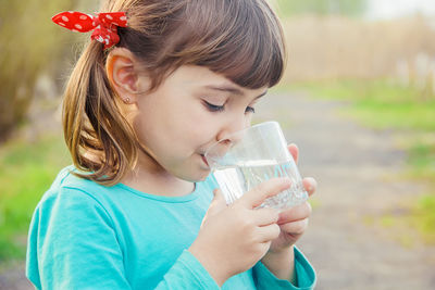 Close-up of girl blowing bubbles