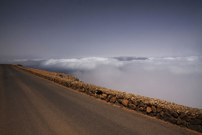 Road amidst landscape against sky