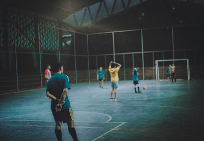 Group of people playing with ball in the background