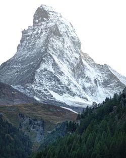 Scenic view of snowcapped mountains against clear sky