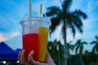 Close-up of hand holding drink