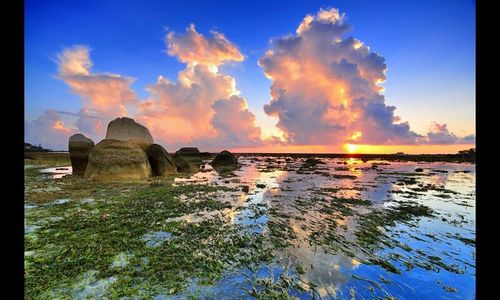 Scenic view of sea at sunset