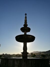 Low angle view of statue against blue sky