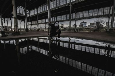 Full length of woman in front of building