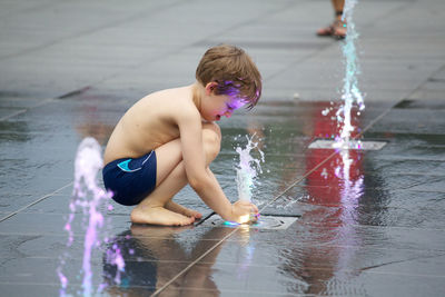 Boy playing in water