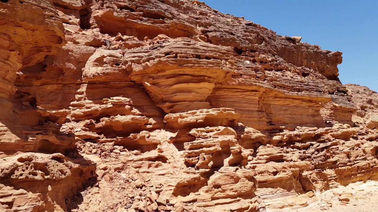 LOW ANGLE VIEW OF ROCK FORMATION