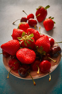 High angle view of strawberries in bowl on table