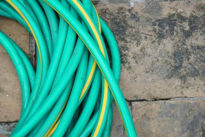 Directly above shot of turquoise pipe on footpath