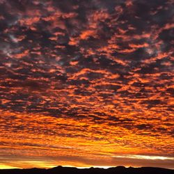 Scenic view of dramatic sky during sunset