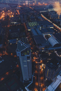 High angle view of illuminated buildings in city at night