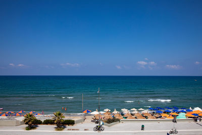 Scenic view of sea against blue sky