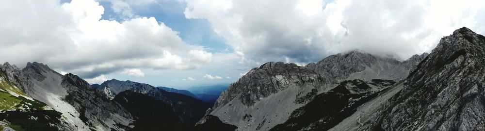 Panoramic view of mountains against sky during winter