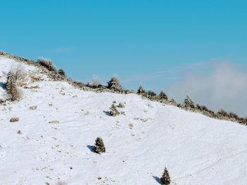 Scenic view of snow covered mountain against sky