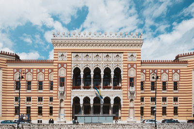 Low angle view of historical building against cloudy sky